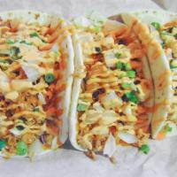 Carolina Chicken Tacos · Pulled Carolina chicken with green and white onions topped with sriracha mayo.