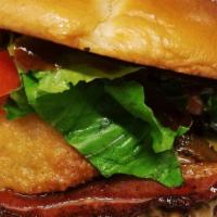 Hercules Burger · 1/3 lb. grass-fed patty, bacon, cheddar cheese, onion ring, lettuce, tomato, BBQ sauce.