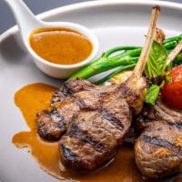 Rack Of Lamb · Chargrilled Lemongrass marinated lamb rack, Broccolini, and Pepper Sauce