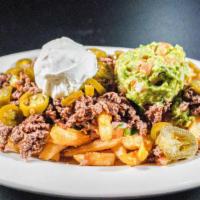 Loaded Fries · Large servind of golden seasoned fries loaded with  nacho cheese, ground beef or chicken, pi...
