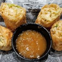 Madisons Handmade Eggrolls · Two large hand rolled and homemade breaded egg rolls deep fried and split in half for sharin...