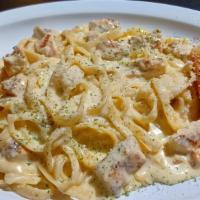 Chicken Fettuccine Pasta · Fettuccine al dente pasta tossed in homemade alfredo sauce with chunks of chicken breast and...