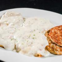 Biscuits And Gravy · Breakfast comfort food at it's best.  Two open faced buttermilk biscuits smothered with home...