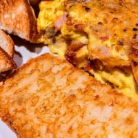 Meat Lovers Omelette Combo · 3 egg omelette filled with ham, bacon and sausage topped with cheddar and pepper-jack cheese...