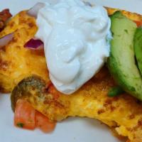 Mexican Omelette Combo · 3 egg omelette with diced tomatoes, onions, jalapenos, pepper-jack cheese and guacamole, top...