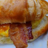 Bacon, Egg And Cheese Croissant · Slices of bacon with scrambled eggs and your choice of cheese served on a buttered croissant...