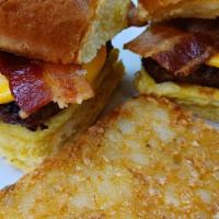 Breakfast Sausage Sliders · 2 sliders made with sausage patties, bacon, scrambled eggs and your choice of cheese on hawa...