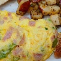 Denver Omelette Combo · Traditional Denver omelette cooked with 3 eggs, ham, bell peppers, onions and your choice of...