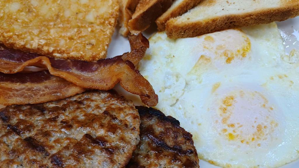 Breakfast 2 Egg Combo · 2 eggs cooked your way, 2 strips of bacon or 2 patties of sausage, 2 slices of toast (choice of bread) and a fried hash brown patty or country potatoes.