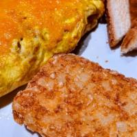 Farmers Omelette Combo · 3 egg omelette with bacon, onions, tomatoes and choice of cheese.  Served with either sausag...