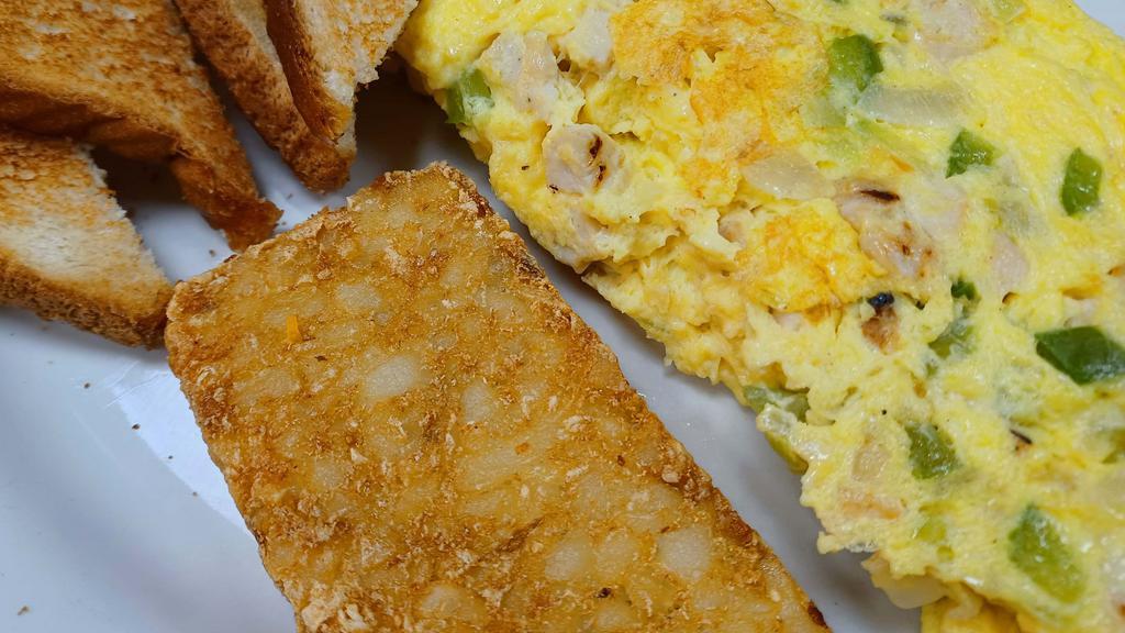 Chicken Omelette Combo · 3 Egg omelette with chicken breast pieces, bell peppers, onions and your choice of cheese.  Served with a deep fried hash brown patty or country potatoes and your choice of toast.