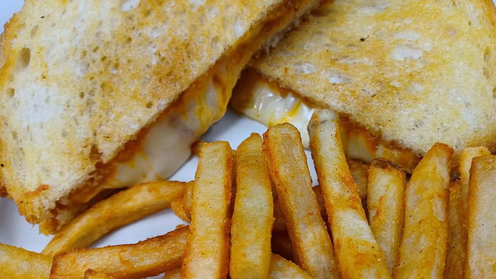 Grilled Cheese Combo Sandwich · Jack, Swiss and Cheddar cheese sandwiched between toasted bread of your choice and served with your choice of either regular seasoned fries or curly fries.  (Choose 3 cheeses)