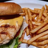 Grilled Chicken Sandwich · Flame grilled chicken breast with lettuce, tomato and choice of cheese served on a round top...