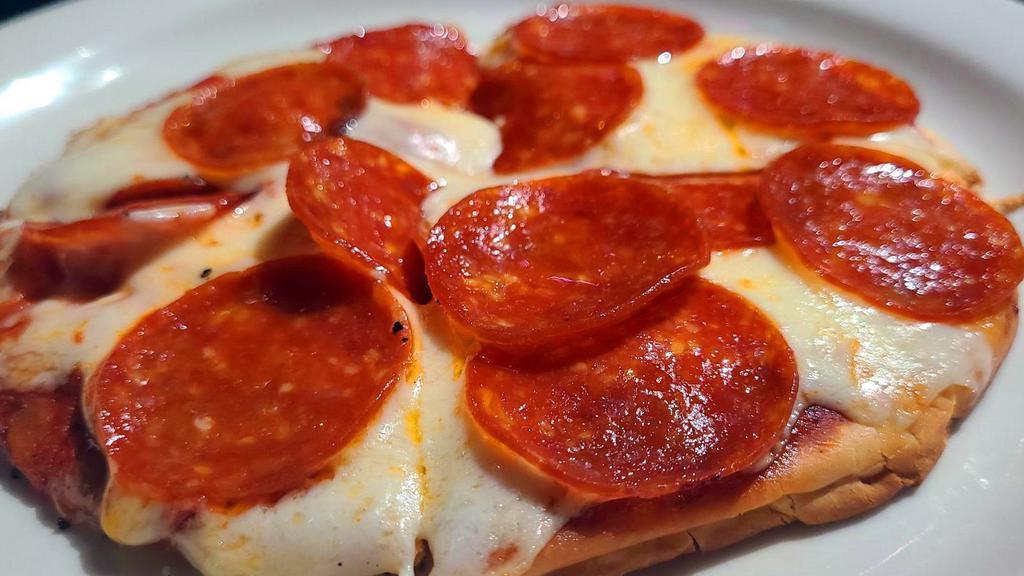 Pepperoni Pizza · Personal seven inch pizza topped with our pizza sauce and covered in pepperoni slices with your choice of cheese: mozzarella, Cheddar, pepper Jack or Swiss.