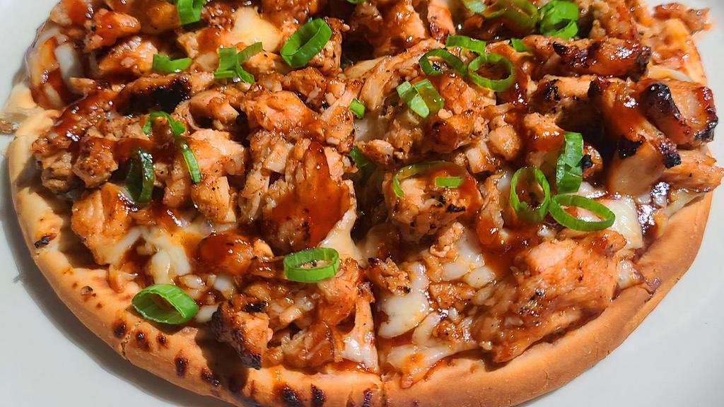 Bbq Chicken Pizza · Personal seven inch pizza topped with BBQ sauce Cheddar cheese, and loaded with BBQ chicken and topped with fresh cut chives.