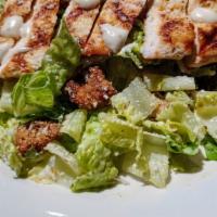 Classic Chicken Cesar Salad · Romaine lettuce tossed in classic romaine dressing with Parmesan cheese and toasted croutons