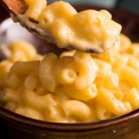 Mac & Cheese · Curly pasta and cheese sauce mixed with chefs special touch of seasoning.