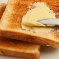 Shack Toast · Brushed toast with butter.