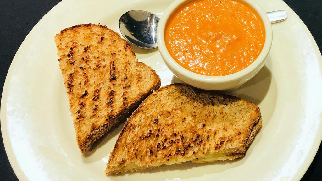 Grilled Cheese & Soup · 580cals. organic whole wheat bread, white cheddar cheese with tomato basil soup