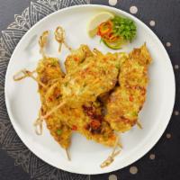 Chicken Satay · (4 pieces) Skewered grilled chicken marinated in Thai spices. Served with a cucumber salad a...