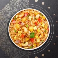 Pineapple Fried Rice · Fried rice with pineapple, onion, cashew nut, and fried egg.