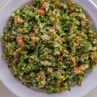Tabbouleh Salad · Parsley, tomatoes, cucumbers, cracked wheat, lemon and olive oil mixed to perfection.