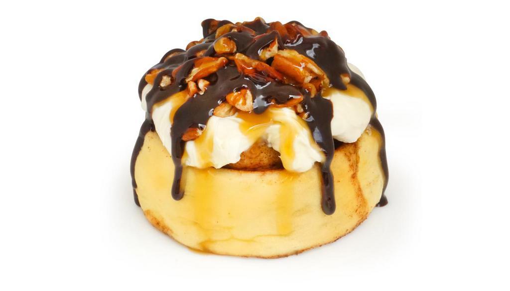 *Turtle · caramel frosting topped with chopped pecans and chocolate sauce