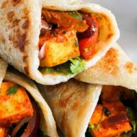 Kathi Rolls · Crispy roti rolled up and filled with potatoes and mixed of spicy vegetables. Selection of p...