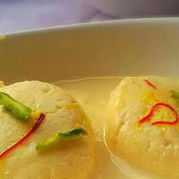 Rasmalai (2 Pieces) · Steamed rice cakes served with lentil soup and chutney