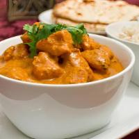 Chicken Tikka Masala · Pieces of chicken breast cooked in spicy creamy tomato sauce