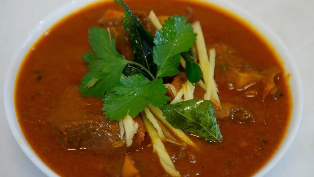 Gongura Goat · Tender bone in goat cooked in curry sauce and Gongura leaves (Red Sorrel).