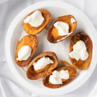 Potato Skins (6 Pc) · cheddar cheese,  sour cream and bacon bits.