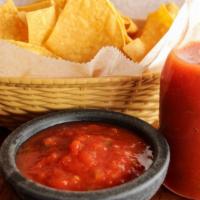 Chips & Salsa · Small bag of chips and  4oz container of homemade red salsa