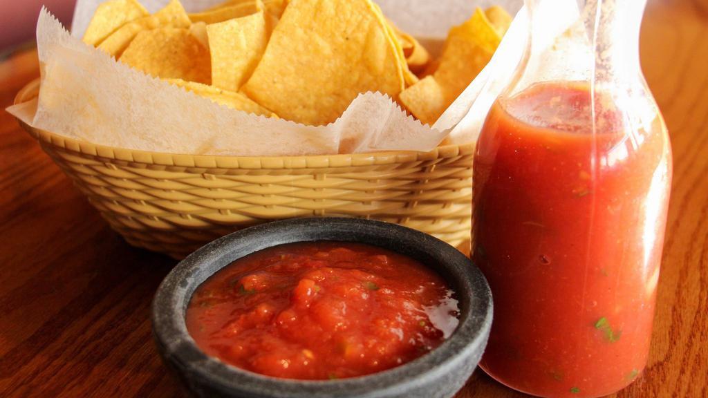 Chips & Salsa · Small bag of chips and  4oz container of homemade red salsa
