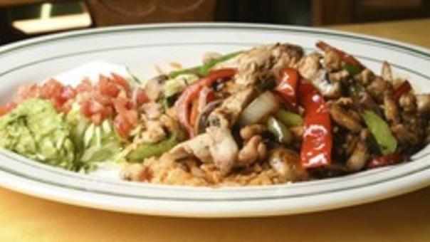 Steak Carnitas · Sirloin steak slices with bell peppers, onions, tomatoes, and cilantro. Served with rice, beans, guacamole.