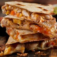 Kids Quesadilla With Meat · Flour tortilla, cheese, meat, rice and beans or French fries.