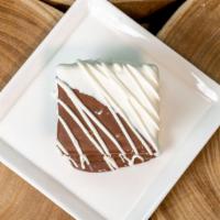 S'Mores · A big marshmallow inside of two graham crackers, dipped in milk and white chocolate