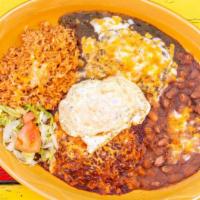 Enchilada Dinner · Spicy thick homemade yellow or blue corn tortillas served open face covered with new Mexico ...