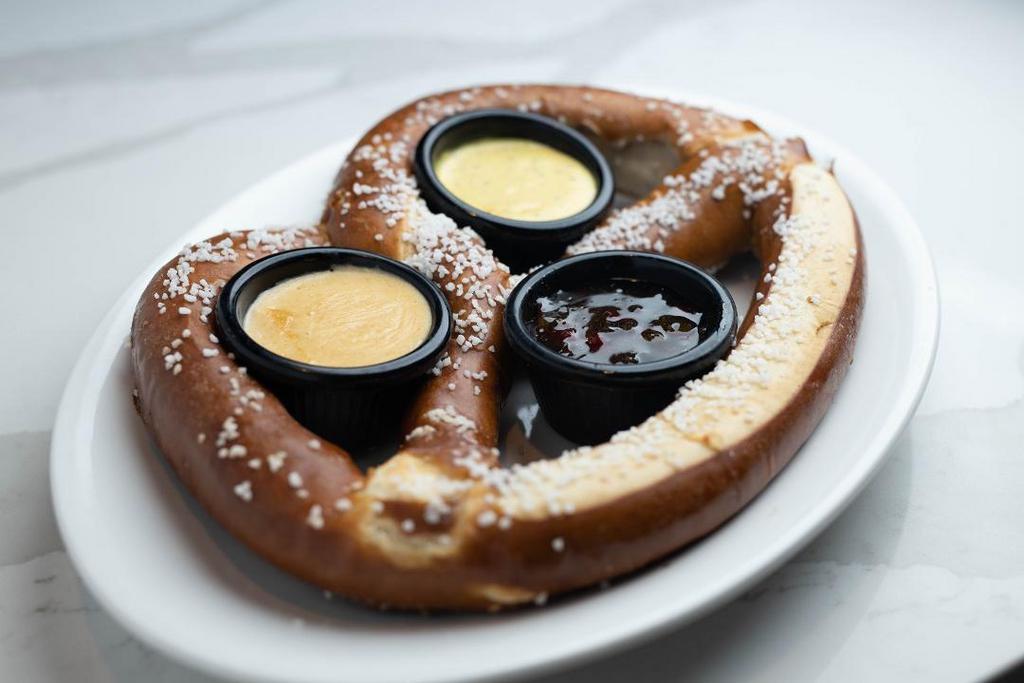 Oven Baked Soft Pretzel · One freshly baked jumbo pretzel, buttered and salted. Served with a Jalapeño Jam, Sweet Mustard Sauce and Thirsty Lion’s Signature Beer Cheese Sauce.