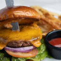 Cheeseburger · 1/2 lb. USDA choice lean ground beef patty prepared on a grilled pub bun spread with burger ...