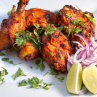 Tandoori Chicken* · Delicious chicken legs marinated with Indian spices and cooked on a slow flame Tandoor. Famo...