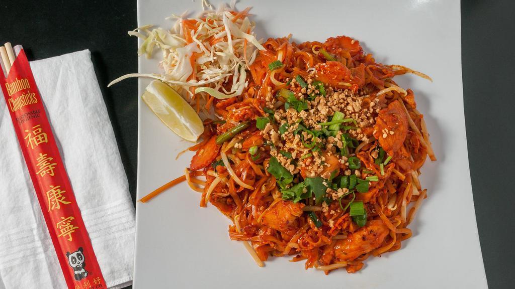 #29. Pad Thai · Stir-fried rice noodles, eggs, sprouts, green onions, carrots and cabbages topped with ground peanut.