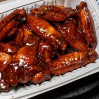 Wings · All orders come with 8 boneless or classic style bone-in wings, celery, and a choice of blue...
