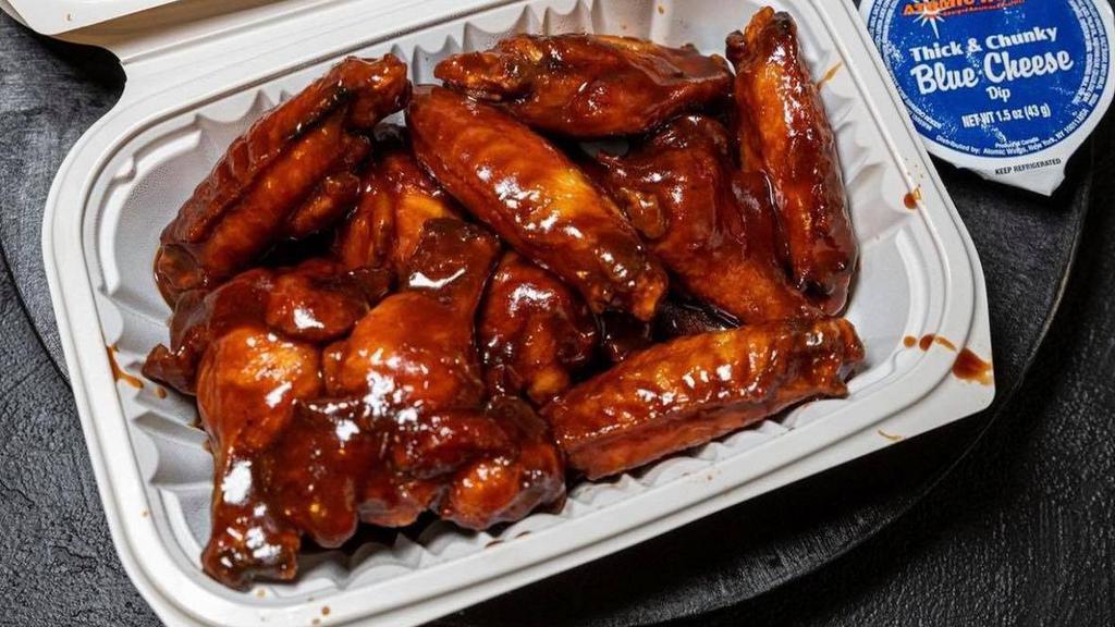 Wings · All orders come with 8 boneless or classic style bone-in wings, celery, and a choice of blue cheese or ranch for dipping.
