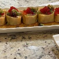 *Palm Spring Roll	 · Tempura shrimp, spicy tuna, and cream cheese. Wrapped in soy paper and lettuce. Topped with ...