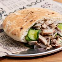 Chicken Shawarma Wrap · Build your Pita or Wrap, filled with your choice of four Salads and Spreads