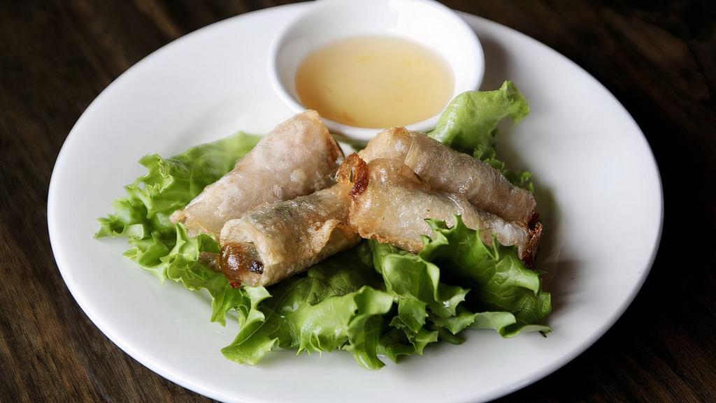 Spring Rolls · Steamed shrimp and pork, lettuce, cucumber, basil, mint, red perilla, and vermicelli noodle - wrapped in rice paper and served with peanut sauce.