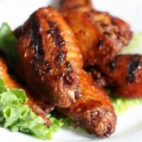 Five Spice Chicken Wings · Grilled crispy and coated with our own unique five-spice blend.
