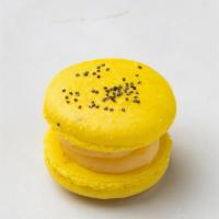 Lemon Poppy Seed French Macaron · Bursting with Lemon and a sprinkle of the irresistible nutty poppy seed.