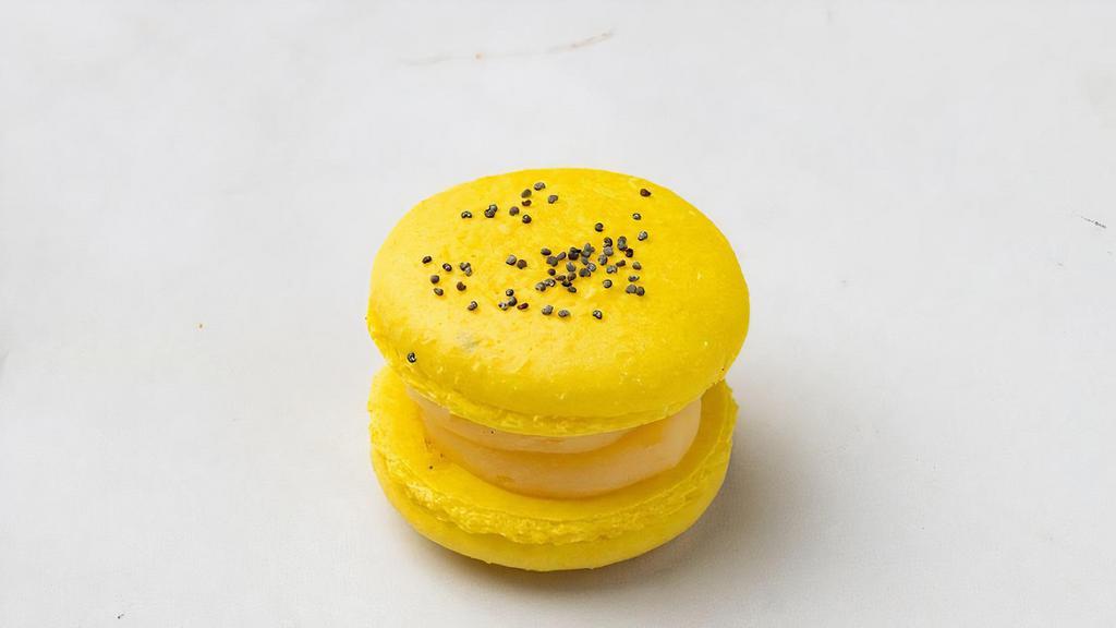 Lemon Poppy Seed French Macaron · Bursting with Lemon and a sprinkle of the irresistible nutty poppy seed.